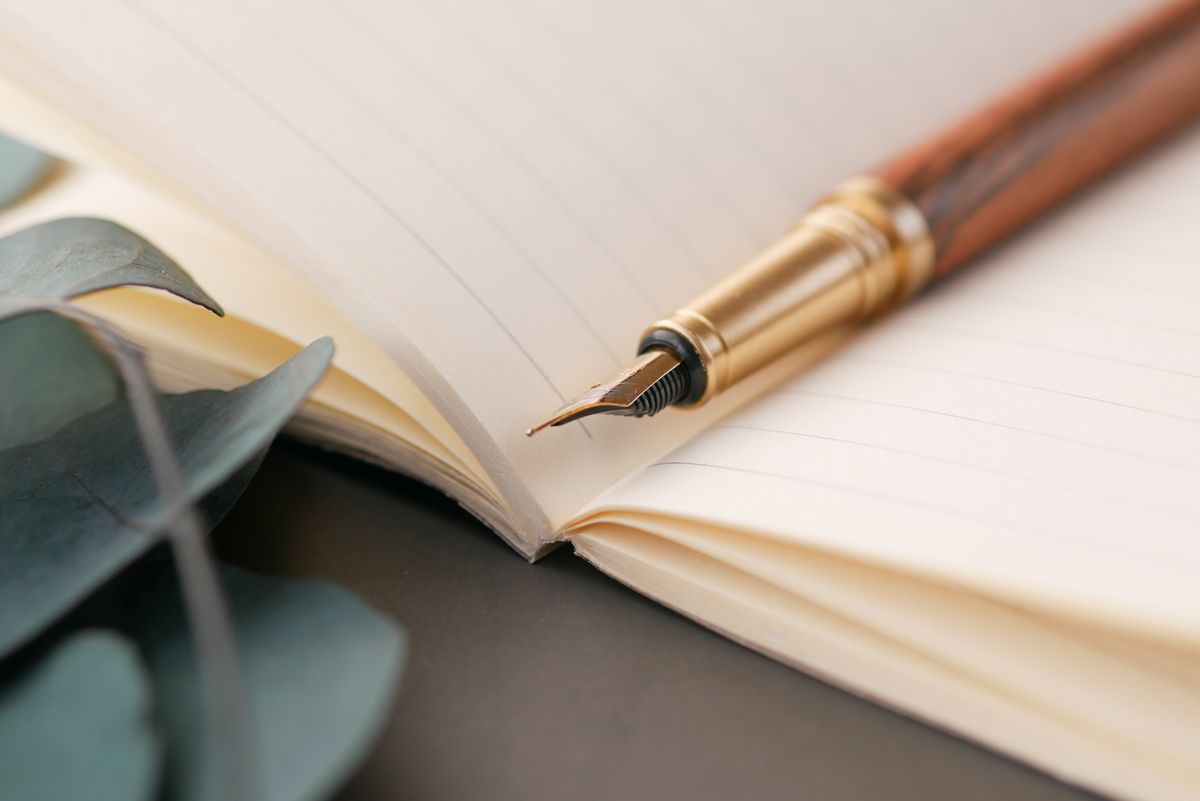 Filofax and fountain pen on a marble desk